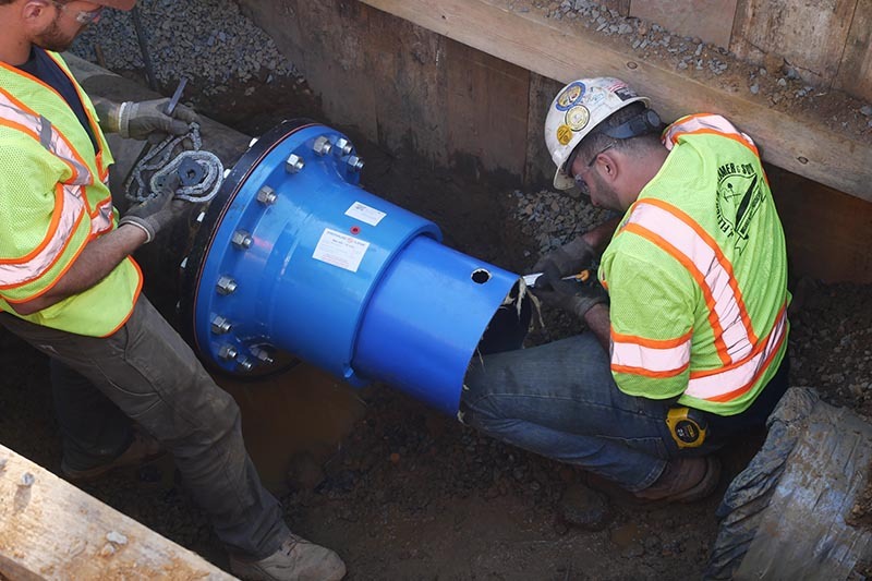 men working on pipeline rehabilitation project