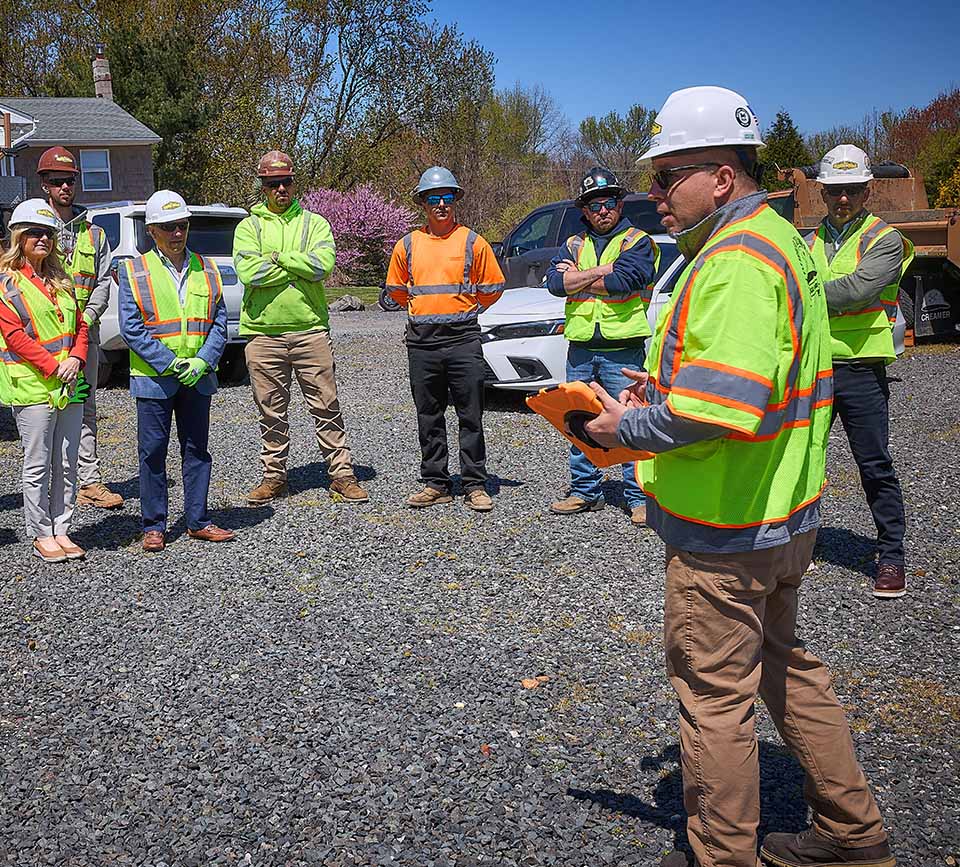 J Fletcher employees during a safety meeting before starting to work