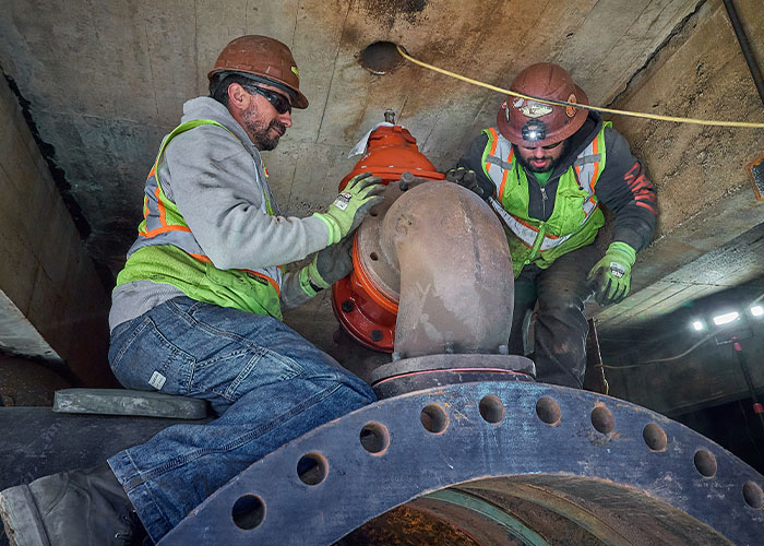Two J Fletcher employees doing water Main Repair works