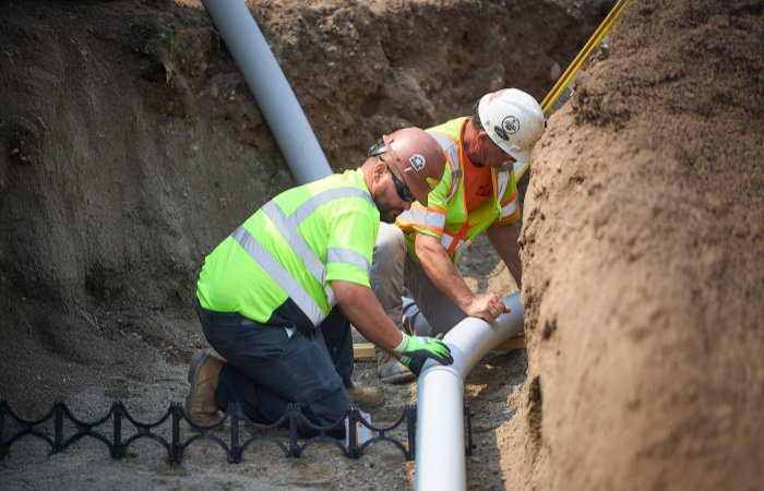 J Fletcher employees doing wind energy transmission and distribution works